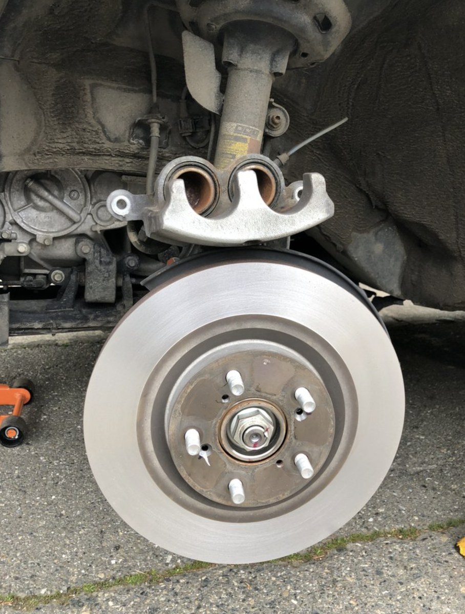Anaheim mobile mechanic finishing a brake job at a customer's complex