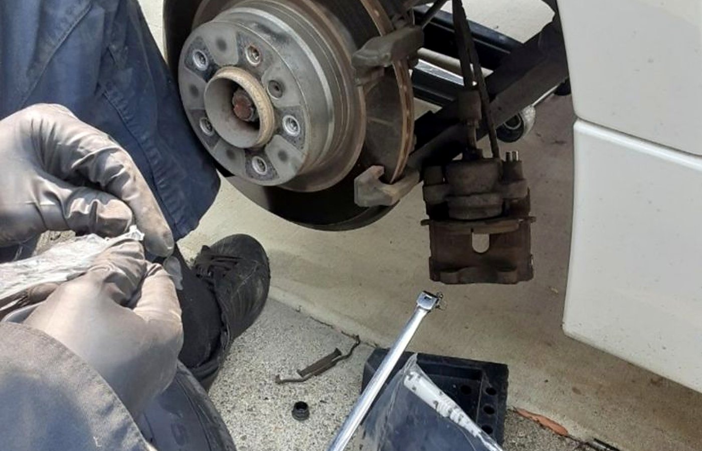 New brake rotor and caliper installed by an Anaheim mobile mechanic